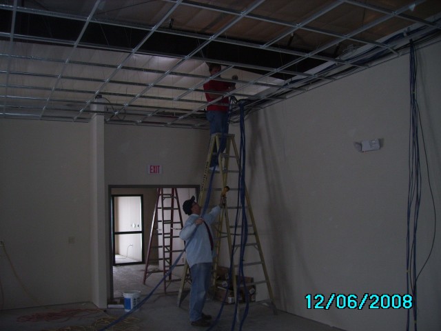 More phone and computer cabling being fed in one of the meeting rooms.  