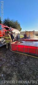 The portable fire tank is utilized at a recent training fire conducted by the Epworth Fire Department