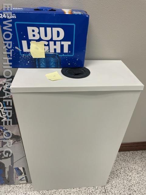 Bud Light and a metal can Box donated by Mike's Auto and LineX of Dubuque