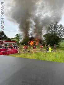 Firefighters standby and protect exposures and the trees after conducting training evolutions at the home east of Placid.